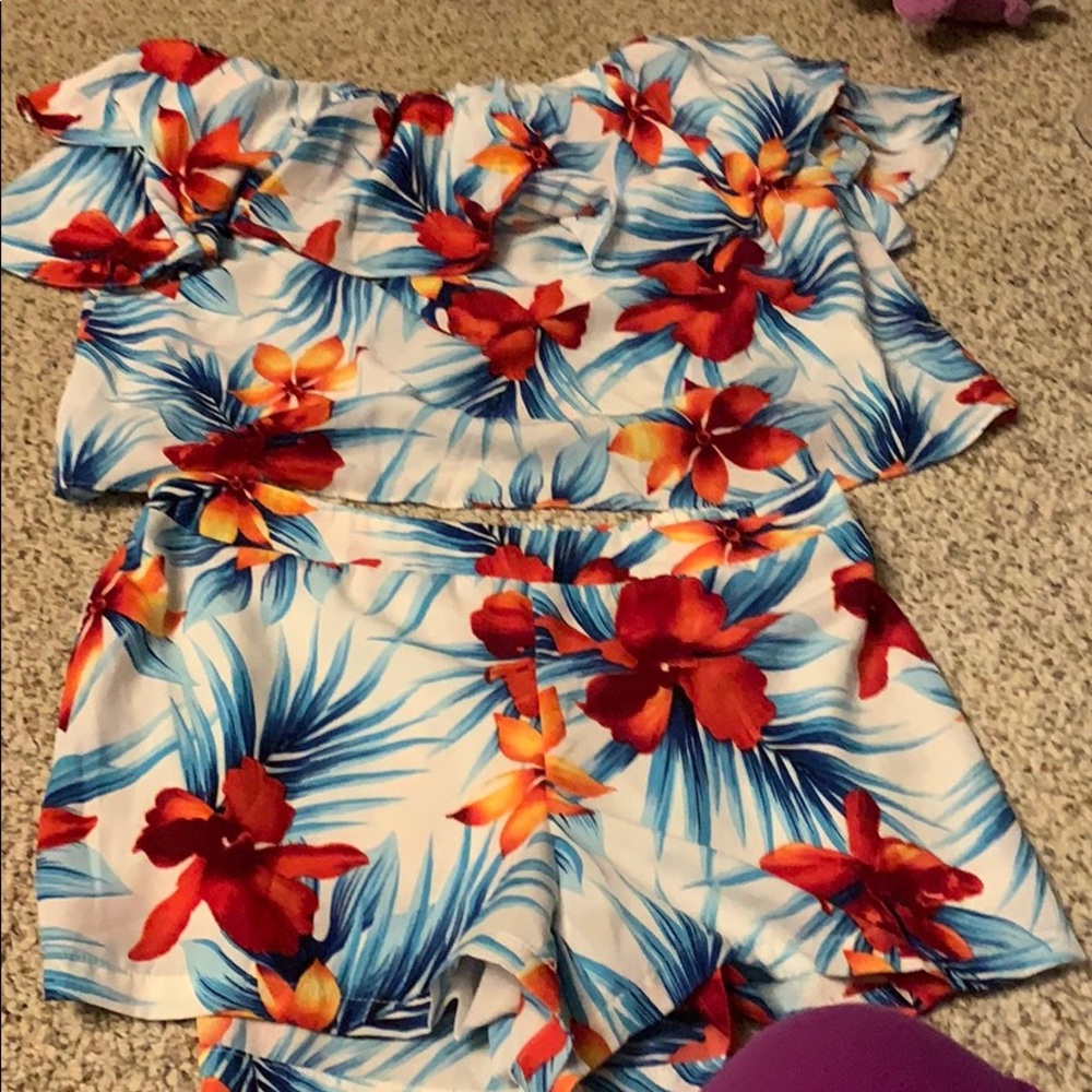 Shirt and shorts matching outfit with flowers.